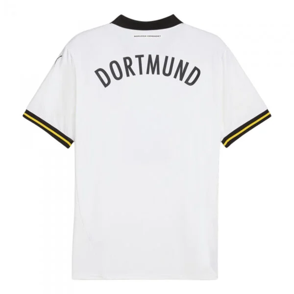 The image displays the back of the white Borussia Dortmund Third Jersey 24/25, featuring DORTMUND in bold black letters at the top and distinctive black and yellow trim on the sleeves.