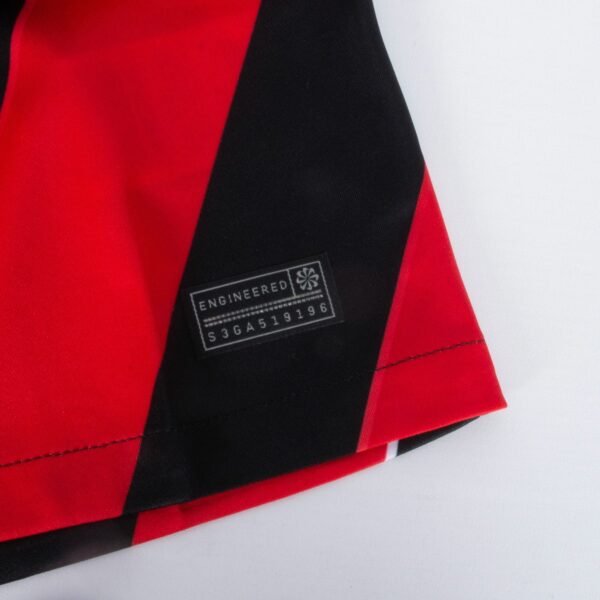 Close-up of the Eintracht Frankfurt Home Jersey 23/24 with a red and black diagonal design.