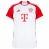 The FC Bayern Munich Home Jersey 23/24 is a white and red soccer jersey with red shoulders and sides. It features a large T logo, an Adidas logo, and a circular emblem with stars near the collar, blending tradition with modern flair.