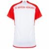The image shows the back of an FC Bayern Munich Home Jersey 23/24, a white soccer jersey with red sleeves. FC Bayern München is prominently displayed in red on the upper back, embodying the spirit of this iconic team.