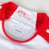 A close-up of the FC Bayern Munich Home Jersey 23/24 reveals ROT & WEIß EIN LEBEN LANG printed on the inner collar. The label indicates size M and Slim Fit.