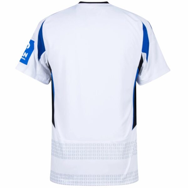 Back view of the Hamburger SV Home Jersey 24/25, featuring short sleeves, a primarily white design with blue and black accents, a geometric pattern at the bottom, and the sponsor logo on the left sleeve.