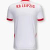 The image reveals the back of the Leipzig Home Jersey 24/25, featuring a white base with bold red accents. RB LEIPZIG is prominently displayed in red, accompanied by the motivational phrase YOU CAN DO ANYTHING above it.