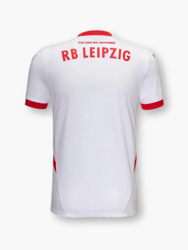 The image reveals the back of the Leipzig Home Jersey 24/25, featuring a white base with bold red accents. RB LEIPZIG is prominently displayed in red, accompanied by the motivational phrase YOU CAN DO ANYTHING above it.