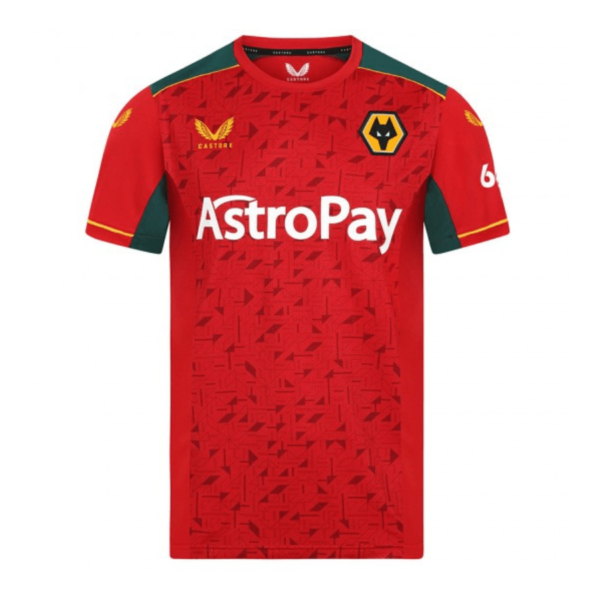 Wolverhampton Away Jersey 23/24 in red has green shoulders, yellow accents, and a geometric pattern. The chest logo resembles a wolfs head, and the AstroPay sponsor name is prominently displayed on the front.