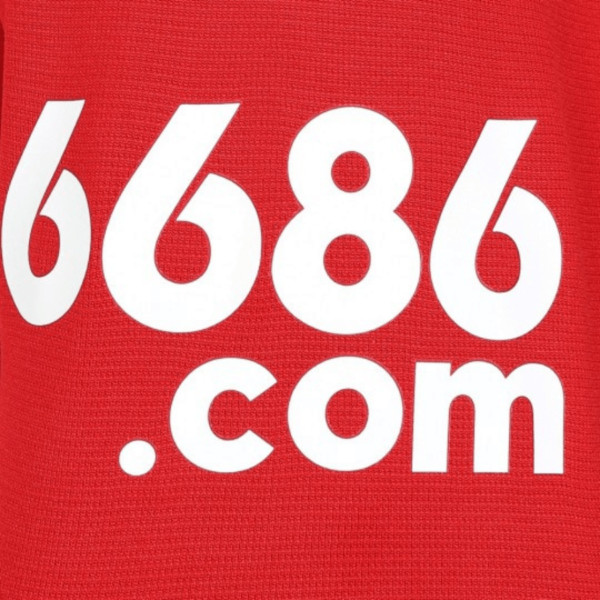 White numbers 6686 and text .com appear on the red background of the Wolverhampton Away Jersey 23/24.
