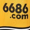 The Wolverhampton Home Jersey 23/24 features a vibrant yellow design with 6686.com in black text. It has a mesh texture and is accentuated by stylish black and white stripes at the bottom.