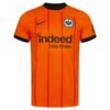 The Eintracht Frankfurt Third Jersey 24/25 is a vibrant orange soccer jersey featuring thin red vertical stripes, a black collar and cuffs, Frankfurt logo on the left chest, the Nike swoosh on the right, and Indeed Jobs finden across the center.