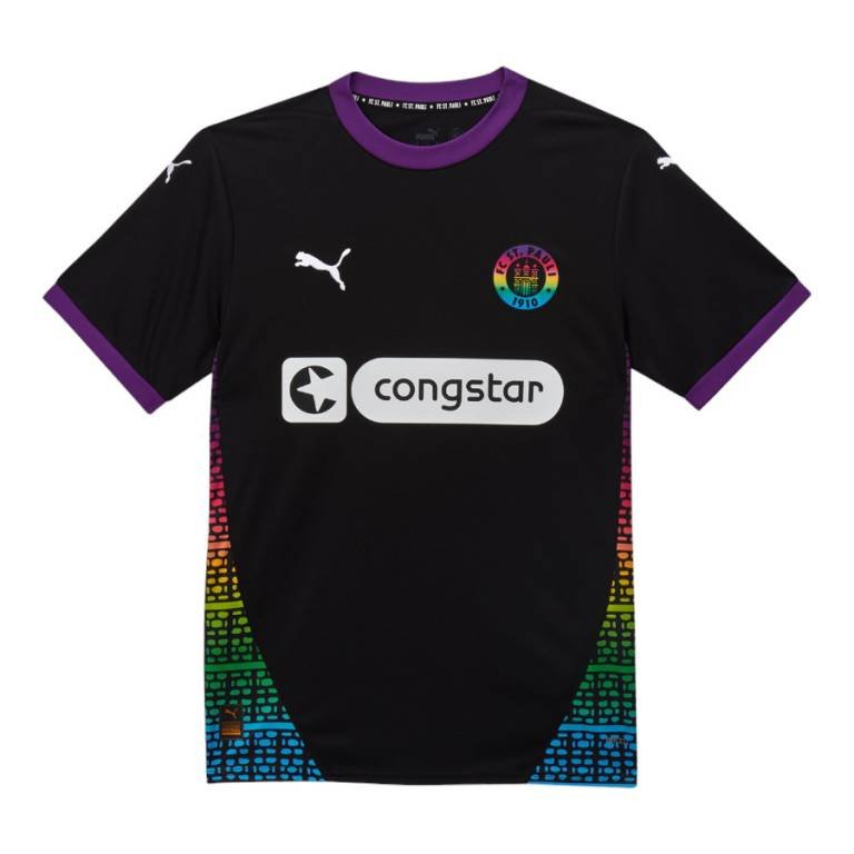 The FC St. Pauli Third Jersey 24/25 features a black design with purple accents on the collar and sleeves, a multicolored brick pattern on the sides, a rainbow-themed logo on the chest, and is completed with white Puma logos and a Congstar sponsor.