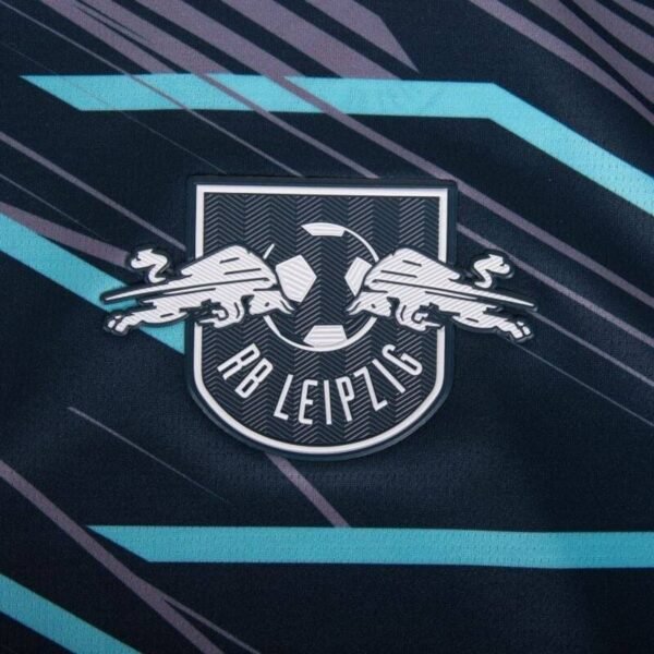 The RB Leipzig logo, set against a dark background with teal and light gray diagonal streaks inspired by the Leipzig Third Jersey 24/25, features two stylized bulls and a soccer ball with RB Leipzig displayed underneath.