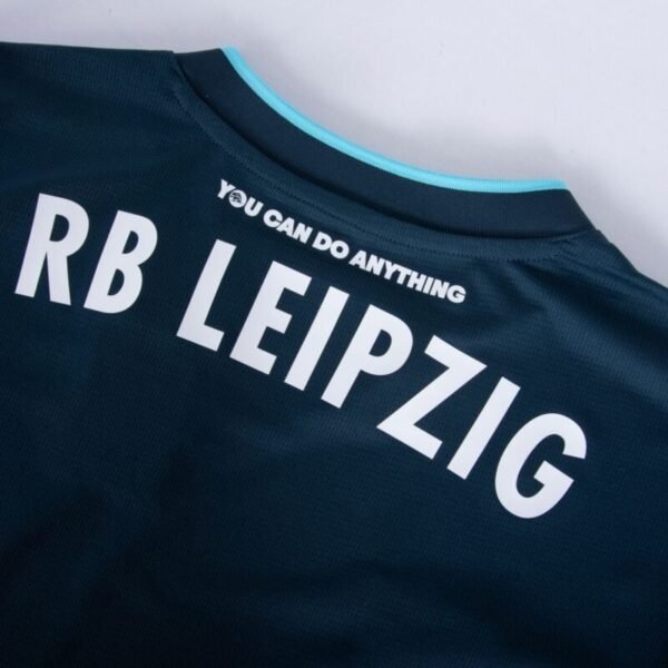 The RB Leipzig Third Jersey 24/25 features RB Leipzig in bold white across the upper back, with You Can Do Anything beneath and a light blue trim on the collar for striking contrast.
