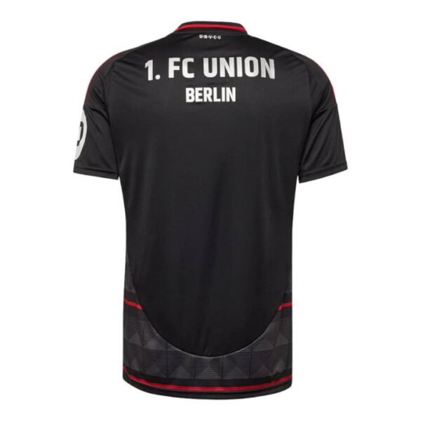 The Union Berlin Away Jersey 24/25 features 1. FC UNION BERLIN in white on the upper back. This black jersey has subtle red accents and a geometric pattern on the lower back, offering stylish sophistication.